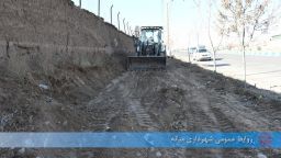 پاکسازی و تسطیح پیاده رو جاده ترانزیت پایین تر از هواشناسی میانه