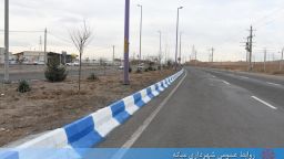 رنگ آمیزی جداول ورودی شهر از سمت زنجان